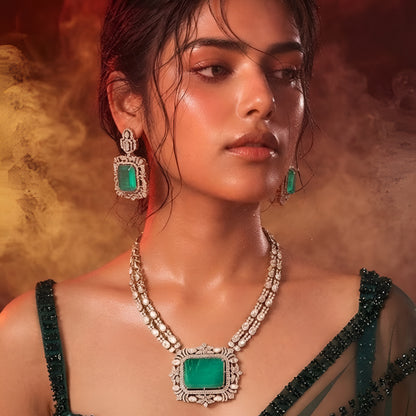 "Antique gold double-strand necklace with large emerald-cut pendant and polki stone detailing, matching drop earrings"
