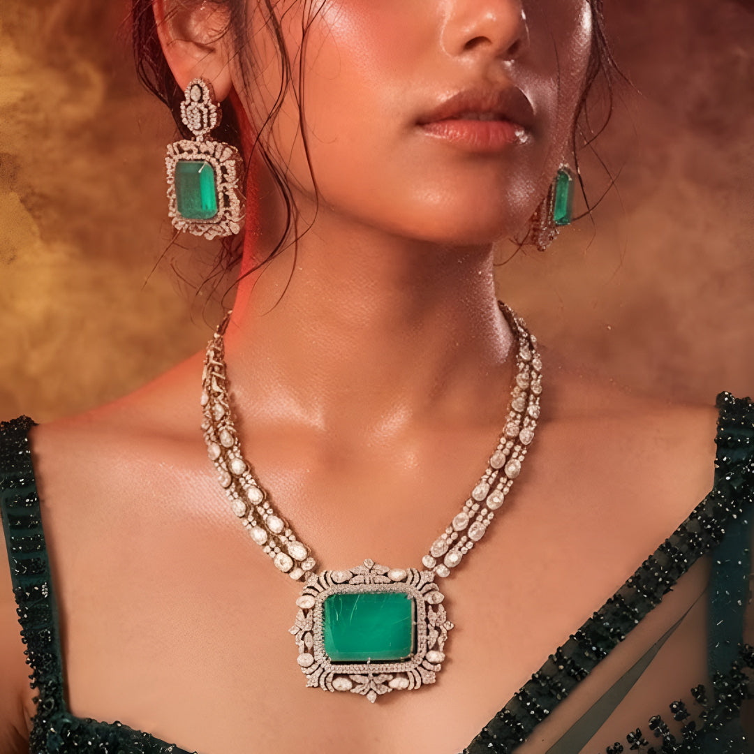 "Antique gold double-strand necklace with large emerald-cut pendant and polki stone detailing, matching drop earrings"