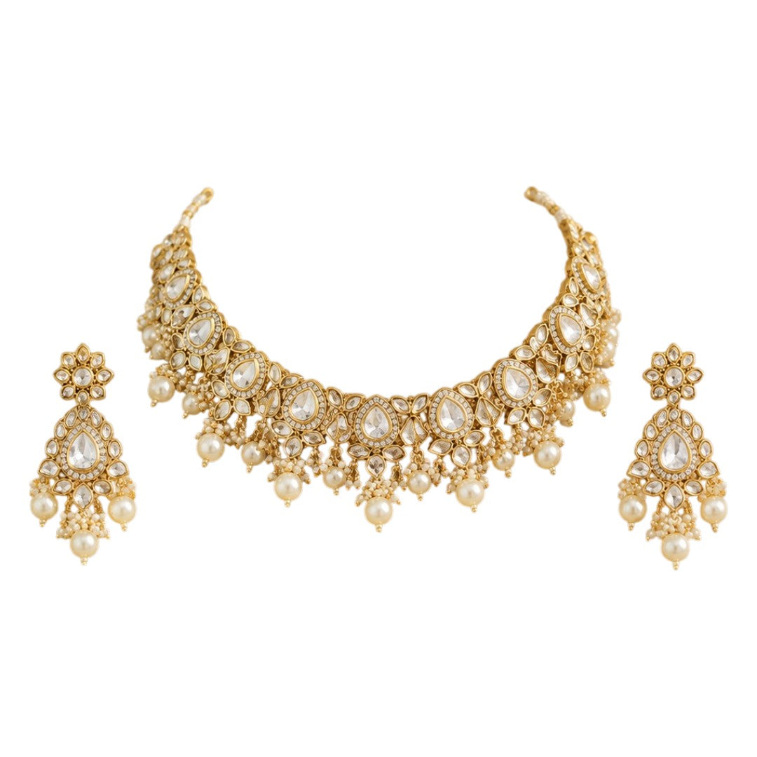 Gold-plated Kundan pearl choker necklace set with American diamond stones and matching pearl drop earrings for bridal, wedding, and festive wear.
