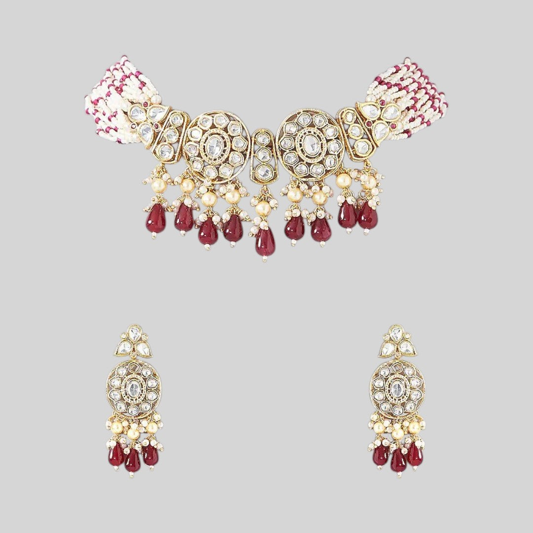 Kundan choker necklace with two round medallions, ruby-red teardrop beads and white pink beaded strands, shown with matching earrings