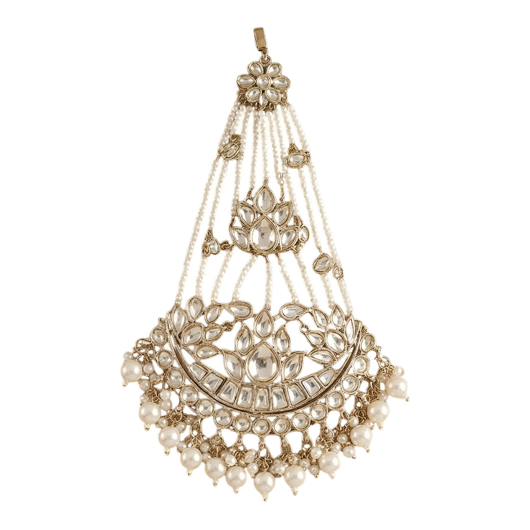 Gold kundan matha patti with pearl chain strands and crescent moon pendant, Indian bridal head jewelry on white background