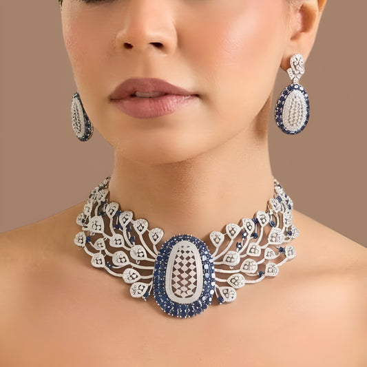 Rhodium finish American diamond necklace with blue oval centrepiece and zircon leaf motifs