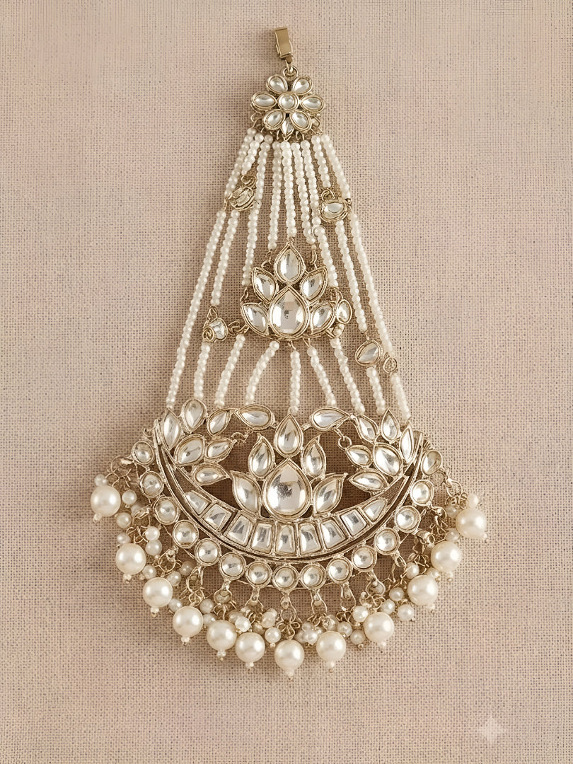 Gold kundan matha patti with pearl chain strands and crescent moon pendant, Indian bridal head jewelry on white background