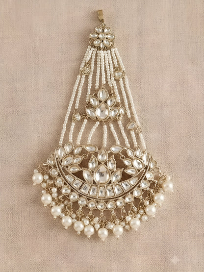 Gold kundan matha patti with pearl chain strands and crescent moon pendant, Indian bridal head jewelry on white background