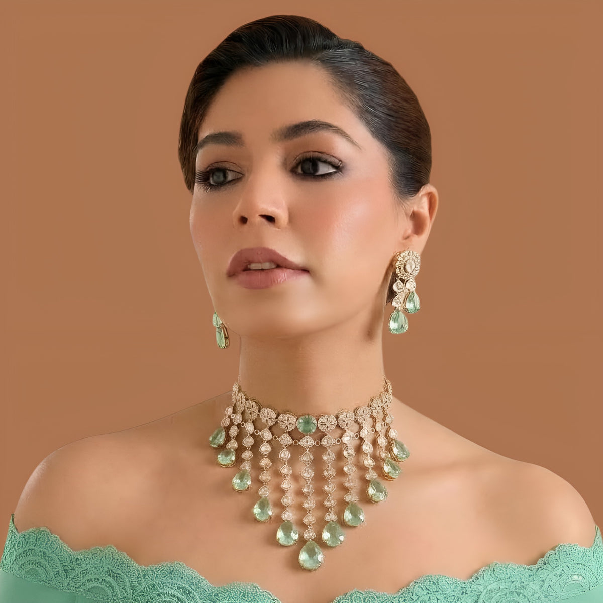 Gold kundan polki choker necklace set with mint green pear drops and matching floral earrings by Auraa Trends