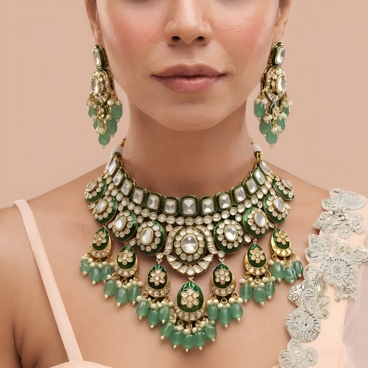 Gold-finish green meenakari kundan polki bridal choker necklace set with mint green bead drops and matching chandelier earrings