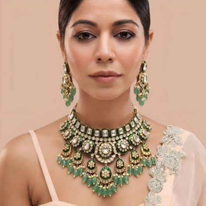 Gold-finish green meenakari kundan polki bridal choker necklace set with mint green bead drops and matching chandelier earrings