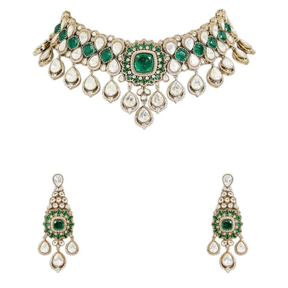 "Antique gold Kundan choker necklace with cushion-cut emerald center and polki teardrop drops, matching chandelier earrings"