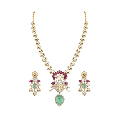 Gold-finish peacock pendant necklace set with ruby-pink stones, carved green drop and matching earrings by Auraa Trends