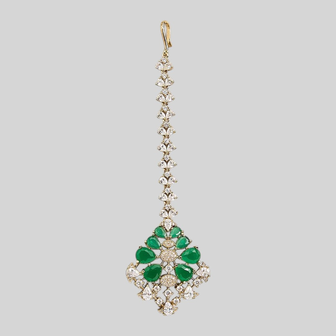 Gold finish American diamond maang tikka with emerald green pear stones, clear zircon accents and a leaf-shaped zircon chain – Auraa Trends