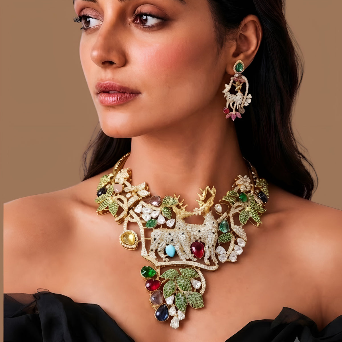 Gold plated deer motif statement necklace with zircon leaves and multicolour stones on a display bust