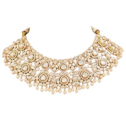 White Kundan necklace set with gold-tone detailing pearl drops and matching earrings
