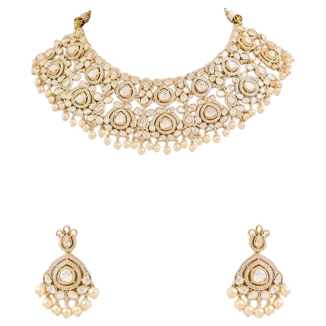 White Kundan necklace set with gold-tone detailing pearl drops and matching earrings