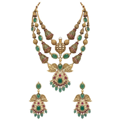 "Antique gold plated kundan polki bridal necklace set with emerald and ruby stones, peacock wing pendant design, and matching jhumka earrings"