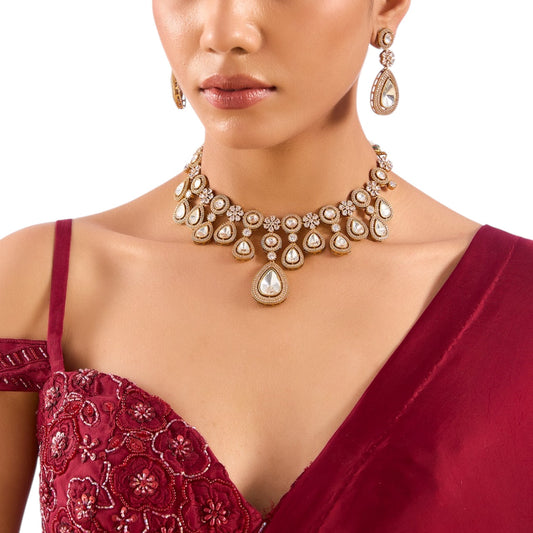 “White kundan choker necklace set with teardrop stones and earrings”

“Gold-tone bridal choker necklace with floral kundan work and crystal details”

“Traditional Indian jewelry set with white stones for weddings”