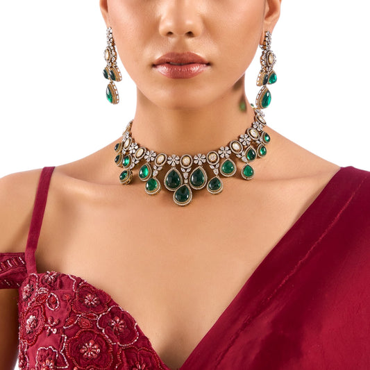 “Emerald green kundan choker necklace set with teardrop stones and matching drop earrings”

“Bridal kundan choker set with white and green stones on antique gold base”

“Statement Indian jewelry set for weddings and festive wear”


