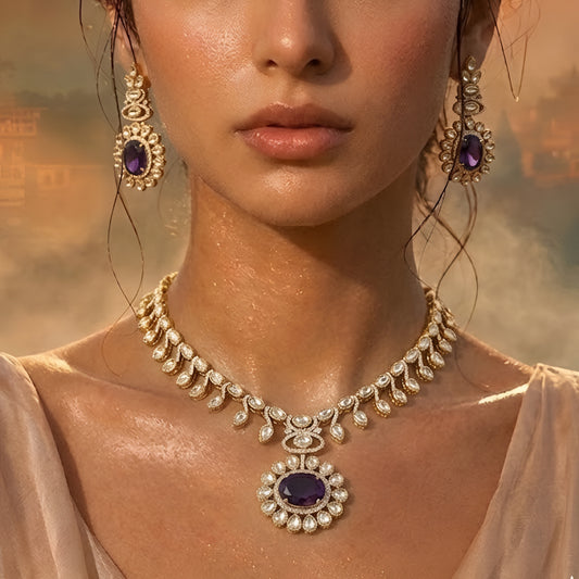 Gold-tone Kundan-inspired necklace and earrings set featuring white stones and deep purple oval gemstone accents in an elegant traditional design.