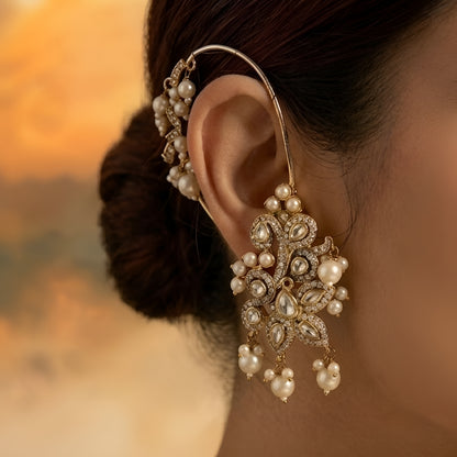 Gold-plated crystal and pearl statement earrings with floral design and dangling pearl accents for weddings and party wear.