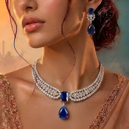 Elegant blue sapphire crystal choker necklace set with zircon-studded silver finish and matching drop earrings for women.