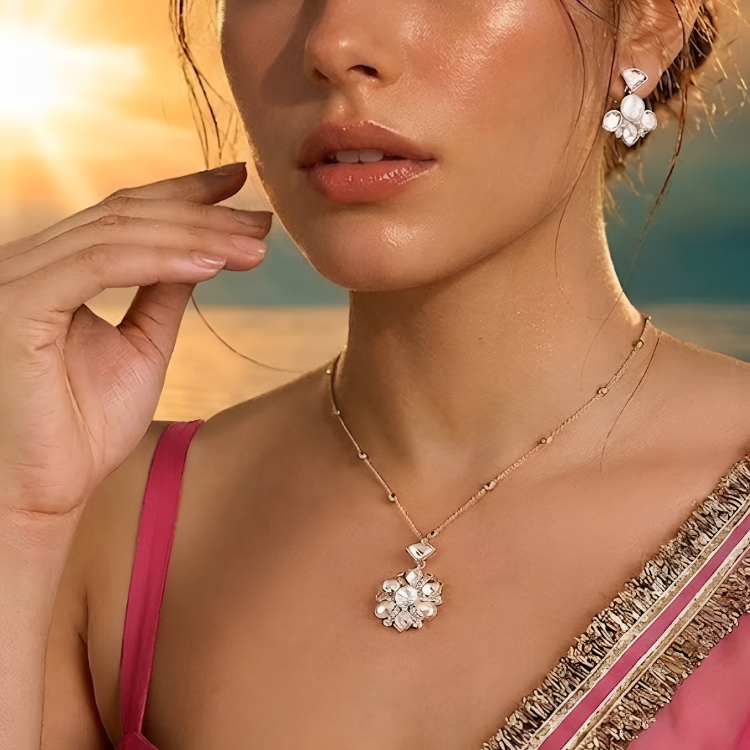 Gold-tone floral crystal pendant necklace with matching crystal earrings jewelry set featuring sparkling clear stones and elegant flower design.