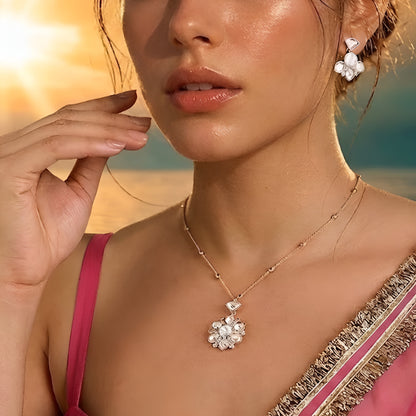 Gold-tone floral crystal pendant necklace with matching crystal earrings jewelry set featuring sparkling clear stones and elegant flower design.