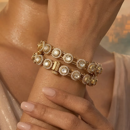 Gold-plated Kundan bangles with round white stone detailing for women, ideal for weddings and festive wear.