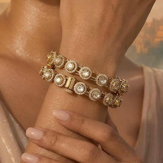 Gold-plated Kundan bangles with round white stone detailing for women, ideal for weddings and festive wear.
