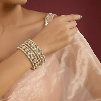 Gold-plated traditional bangles with Kundan stones and pearl embellishments for women
