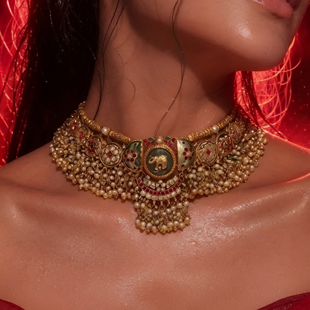 "Antique gold meenakari choker necklace set with elephant motif and matching pearl jhumka earrings, traditional bridal jewellery"