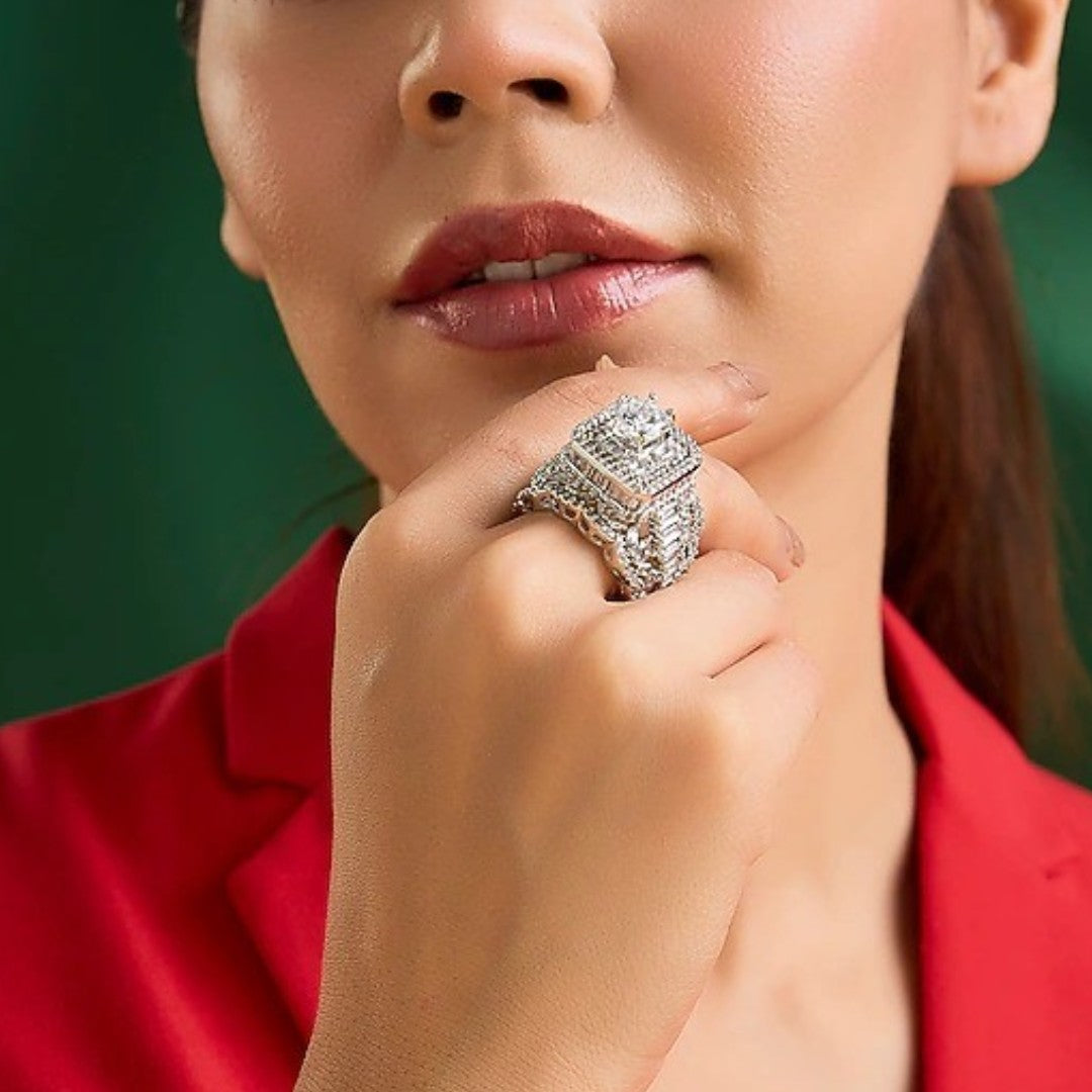 Luxury silver-tone cubic zirconia statement ring with princess-cut center stone and baguette crystal accents