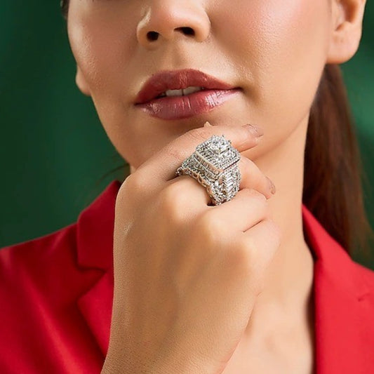 Luxury silver-tone cubic zirconia statement ring with princess-cut center stone and baguette crystal accents