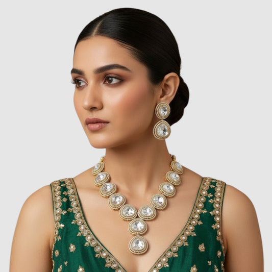 "Gold-plated Polki Kundan statement necklace set with oversized stones and matching earrings"