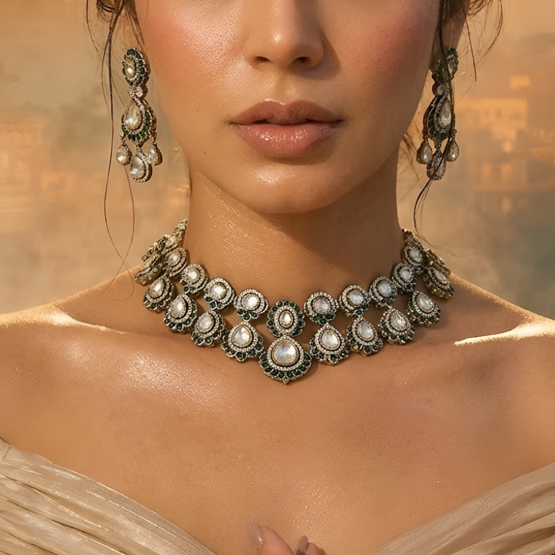 Green Kundan Polki bridal necklace set with matching earrings featuring white stones and emerald green accents in antique gold finish.