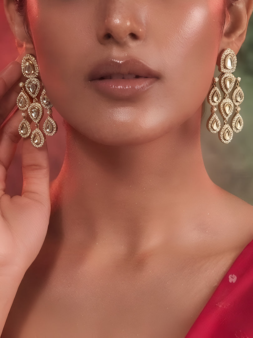 "Gold-plated American Diamond chandelier earrings with multi-tier teardrop CZ clusters, statement party wear earrings on white background"
