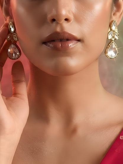 "Gold-plated teardrop crystal earrings with leaf cluster design and pear-shaped CZ drop, elegant party wear earrings on white background"