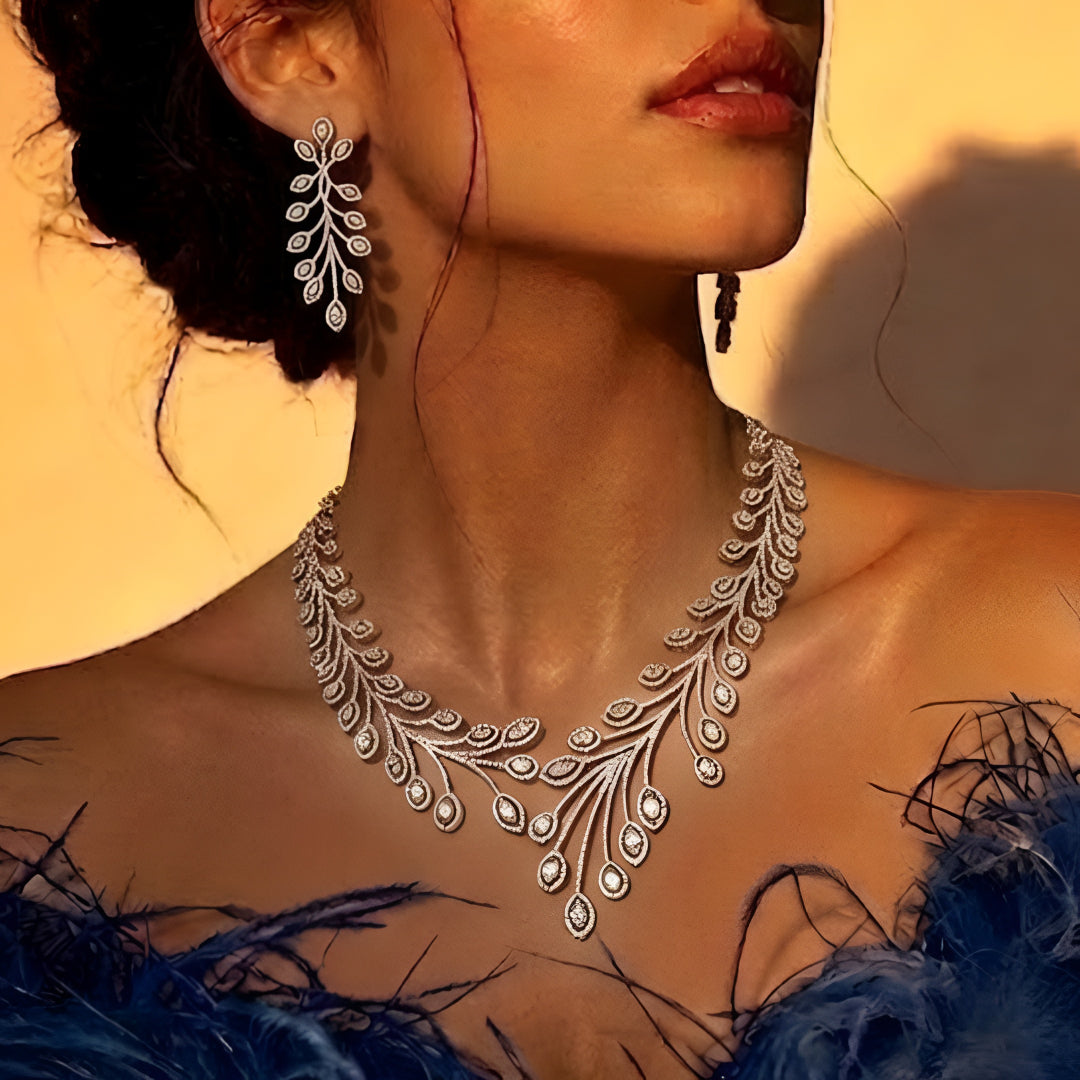 Elegant leaf design diamond necklace set with matching earrings in white gold finish, luxury bridal jewelry for weddings and special occasions.