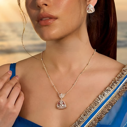 Gold-plated pink stone pendant necklace set with matching stud earrings featuring marquise-cut crystals and elegant enamel detailing.