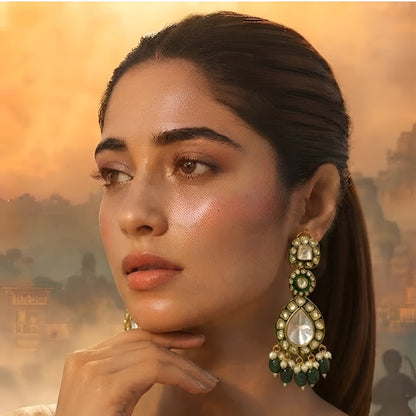 Green Kundan Polki drop earrings with gold finish, pearl clusters, carved green bead tassels, and traditional Indian bridal design.
