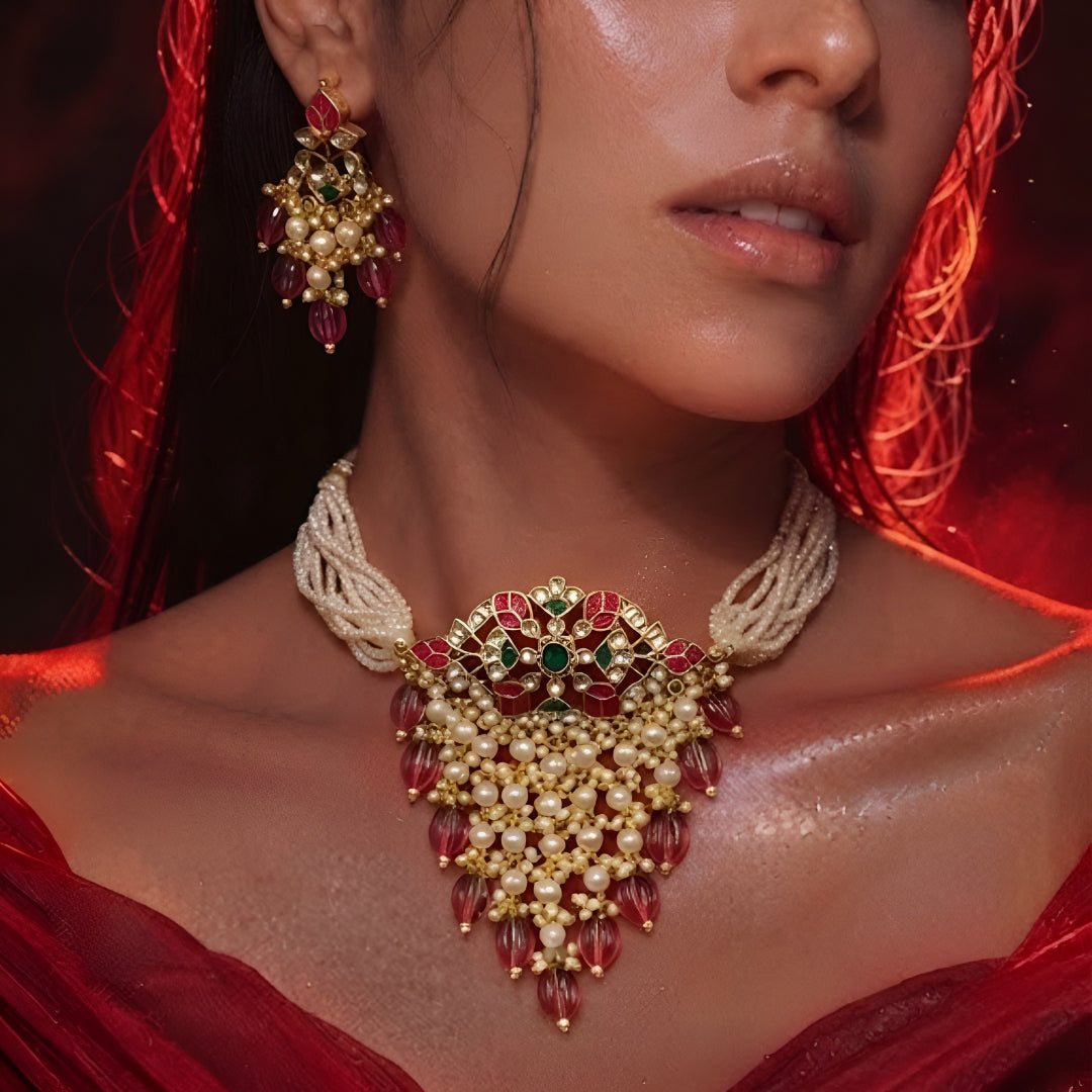 "Traditional Indian bridal jewelry set with pearl strands and maroon beaded tassels"
