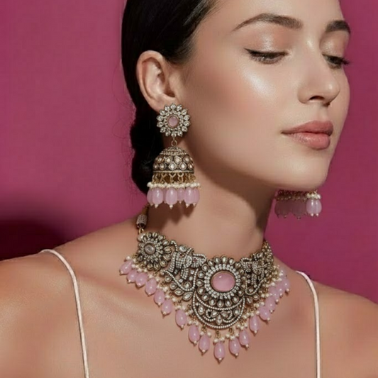 Antique oxidized choker necklace set with pink beads and floral motifs, paired with matching jhumka earrings – traditional Indian jewelry