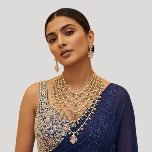 "Multi-layered gold-plated Kundan necklace set with pastel pink and green stones and matching earrings"