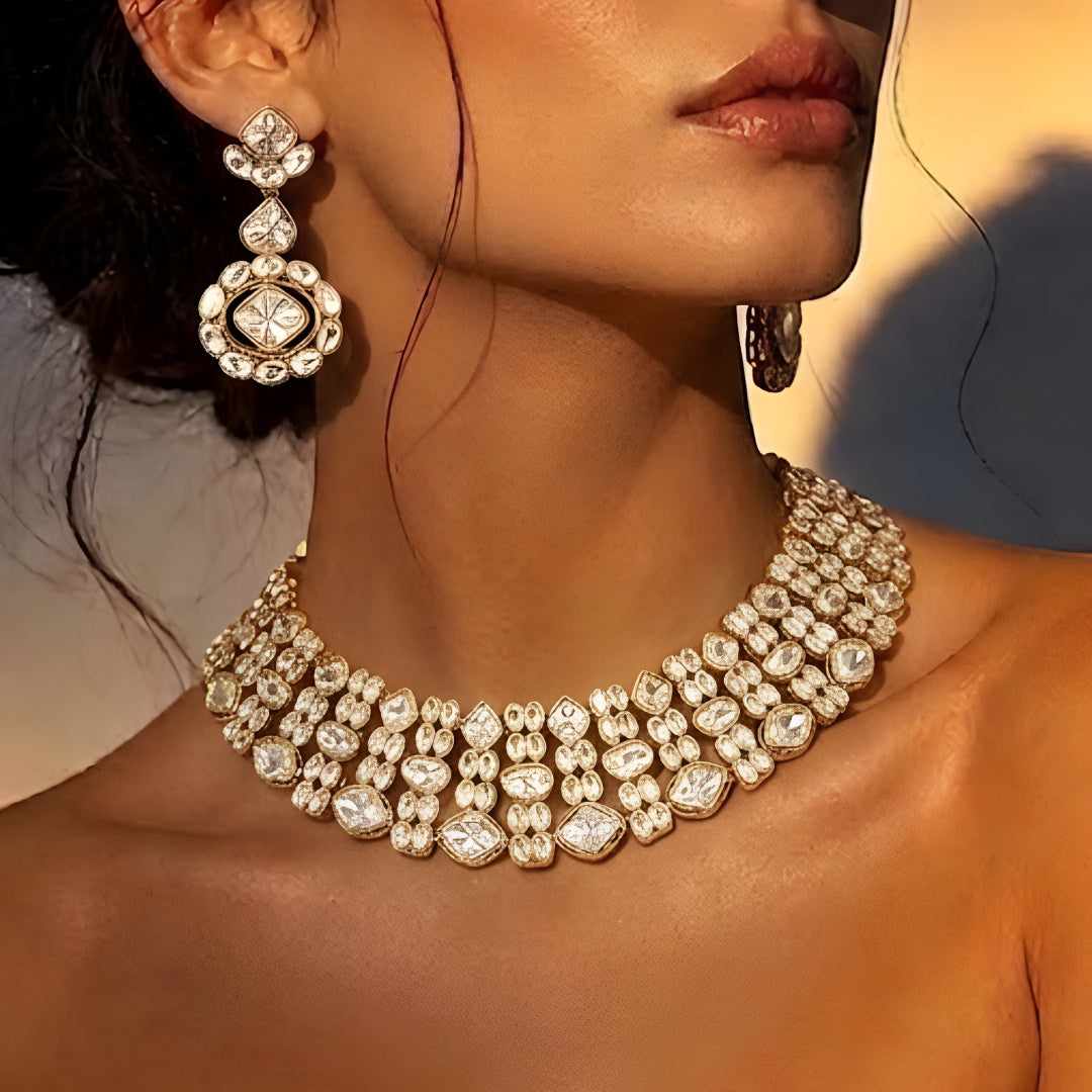 Gold-tone Kundan choker necklace set with matching earrings featuring white uncut-style stones, ideal for bridal, wedding, and festive wear.