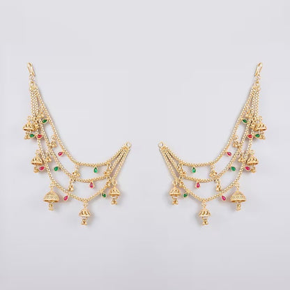 Traditional gold plated multilayer Kaan Chain with jhumka charms and red green stone detailing for women, perfect for bridal, wedding, festive, and ethnic wear.