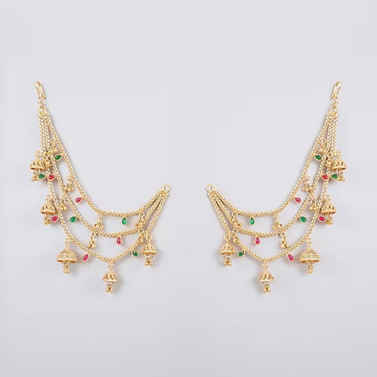 Traditional gold plated multilayer Kaan Chain with jhumka charms and red green stone detailing for women, perfect for bridal, wedding, festive, and ethnic wear.