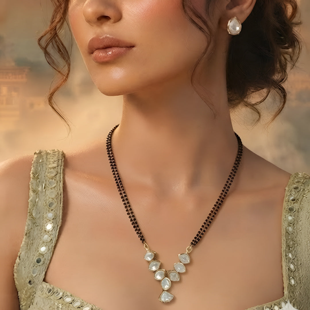Elegant pear stone black beads mangalsutra necklace set with matching stud earrings in gold-tone finish for women