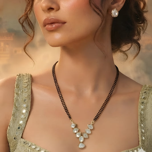 Elegant pear stone black beads mangalsutra necklace set with matching stud earrings in gold-tone finish for women