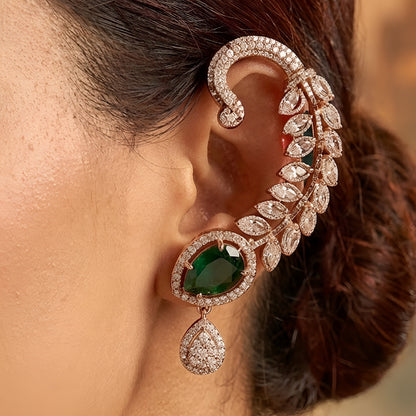 Gold-plated leaf design ear cuff earrings with emerald green teardrop stones and sparkling crystal embellishments for women.