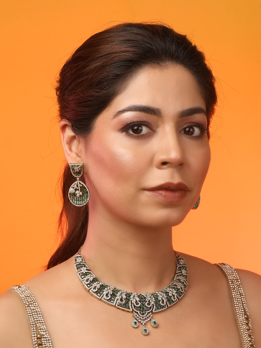 Emerald and diamond statement necklace set with matching drop earrings in gold finish