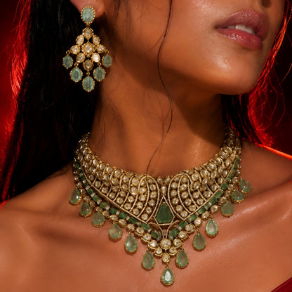 Heavy statement Indian bridal jewellery set styled on green backdrop