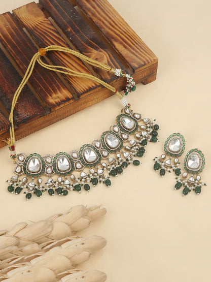 Elegant gold-tone choker necklace set with large mirror-polished stones, green bead accents, and pearl detailing, paired with matching dangling earrings
